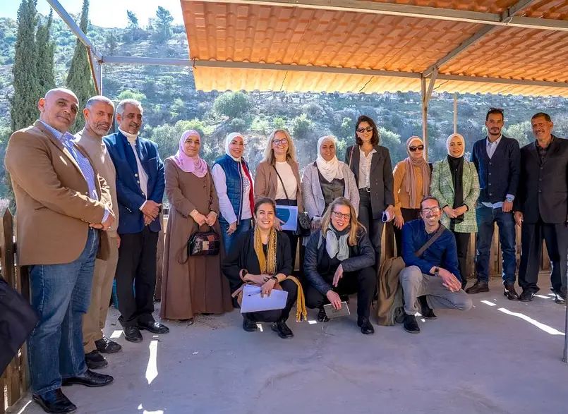 Local community members from Wadi Al-Seer, along with representatives from the Wadi Al-Seer Springs Cooperative, FCDO, IWMI and IUCN, gathered in front of the Wadi Al-Seer Spring, Jordan. Photo: Zaid Kanaan / IWMI